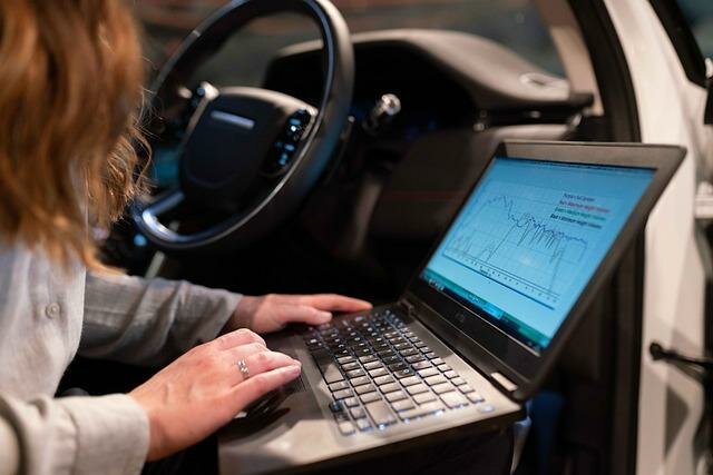 Image of a Car engineer testing a car