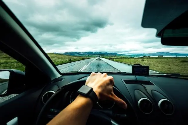 Image of an Open Road and Car Steering Wheel