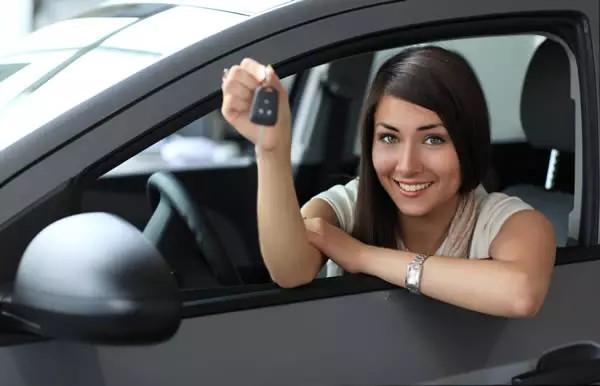 Image of a Lady in a Car with a Key