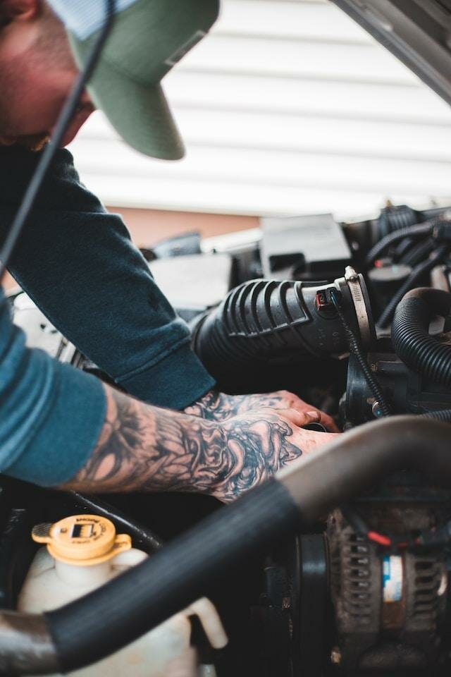 Image of a Mechanic working on a car