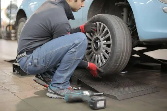 Image of a Mechanic Changing a Car Tyre