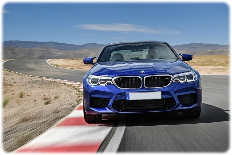 New 2018 BMW M5 front view driving on a track 