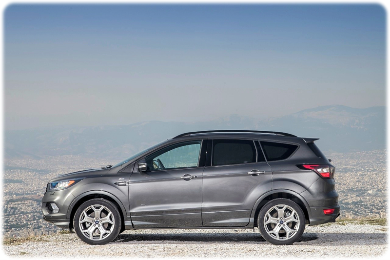Top 5 New Cars February 2018, The Ford Kuga Side on View. Sat on the edge of a hill overlooking a town. 