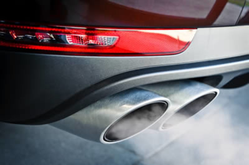 Close of car exhaust with emissions