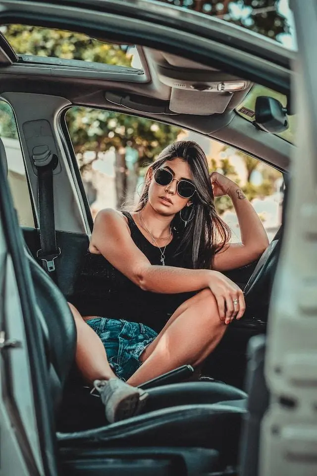 Image of a lady sat in a Peugeot 308 