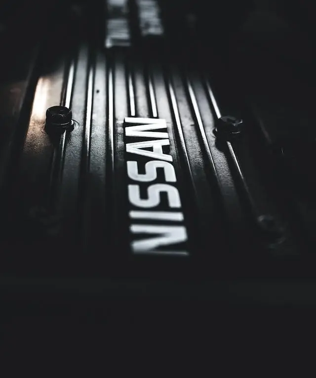 Image of the Nissan Logo on an Engine