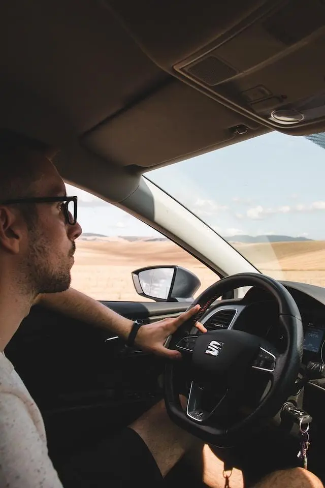 Image of a Man Driving a SEAT Car