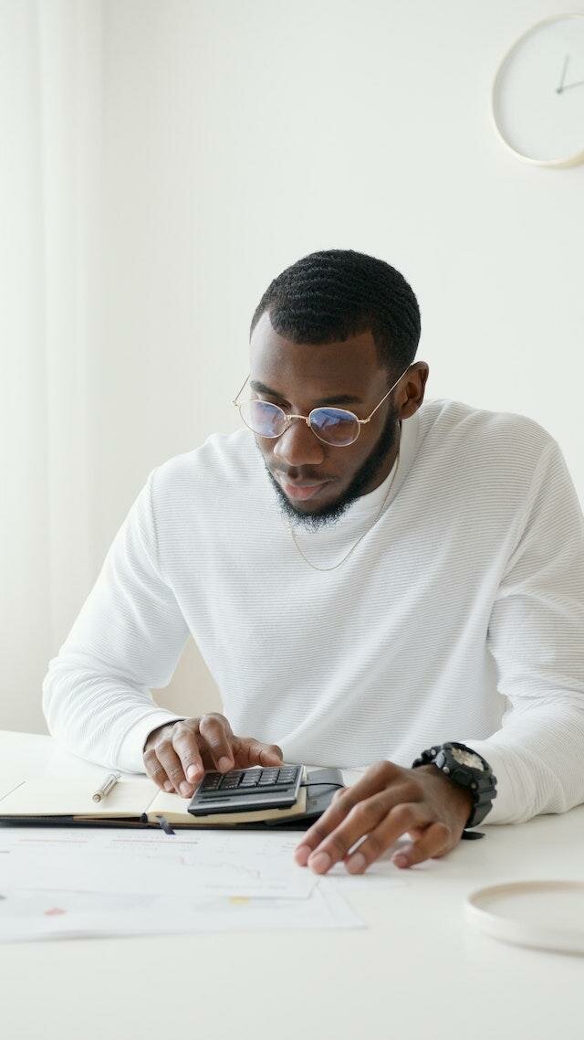 Image of a Guy Calculating his Car Tax in 2023