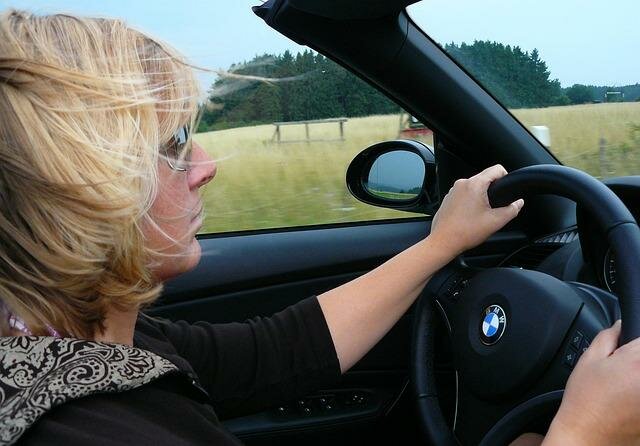 Woman Driving a BMW