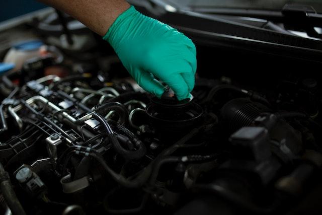 Image of a Car Technician working on a car