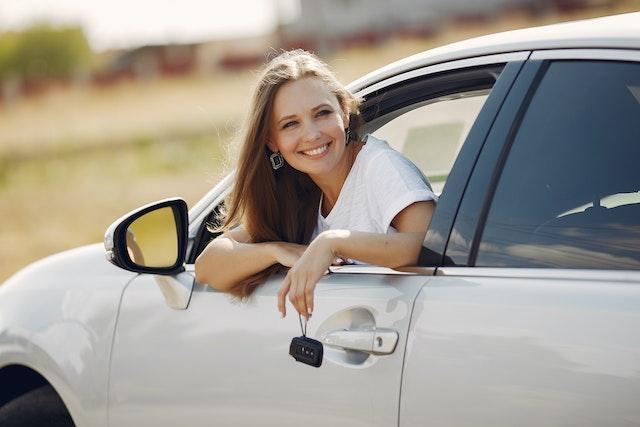Lady Leaning out of her Car Window